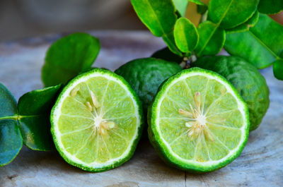 Close-up of green fruits on table