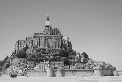 Low angle view of le mont-saint-michel against clear sky