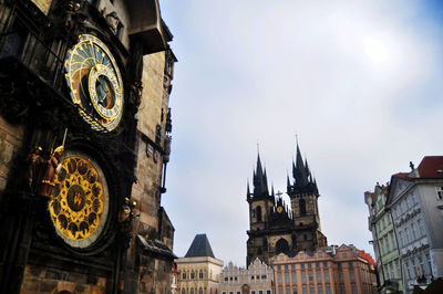 Low angle view of clock tower against sky