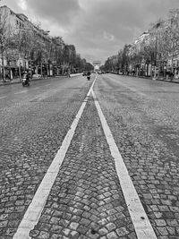 Surface level of road against sky in city