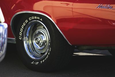 Close-up of vintage car on road