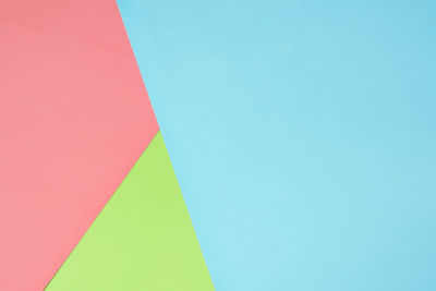 Low angle view of flag against blue sky