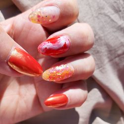 Close-up of hand holding tomatoes