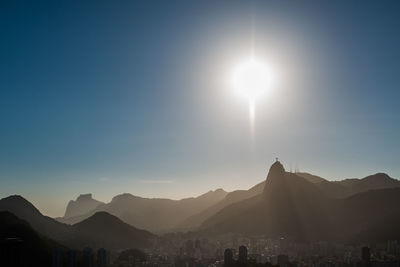 Scenic view of silhouette mountains against clear sky