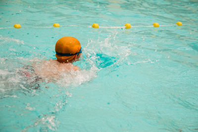 High angle view of swimming in pool