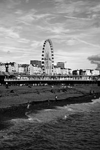 Ferris wheel against cloudy sky