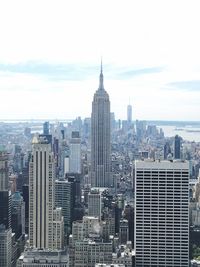 Modern buildings in city against sky