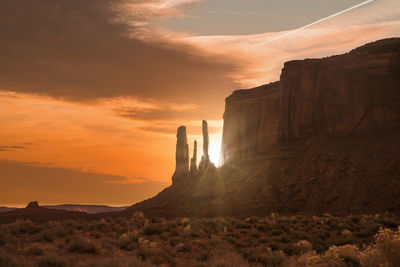 Scenic view of rock formation against sky during sunset