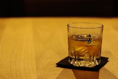 Close-up of beer glass on table