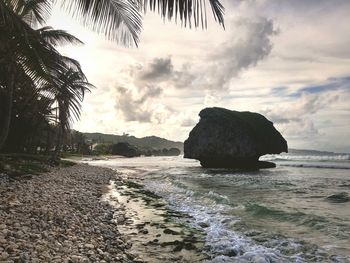 Scenic view of sea against cloudy sky