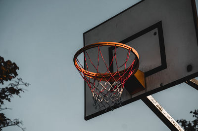 Low angle view of basketball hoop against sky