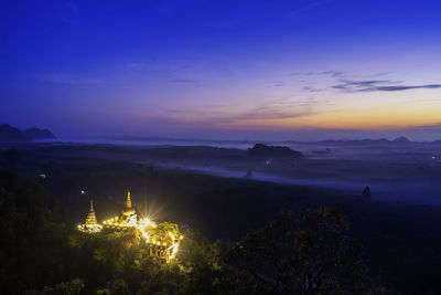 Scenic view of landscape against sky at sunset