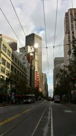 Road in city against sky