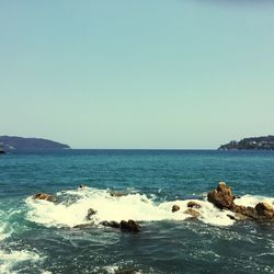 Scenic view of sea against clear sky