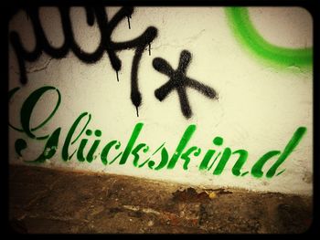 Close-up of text on wall