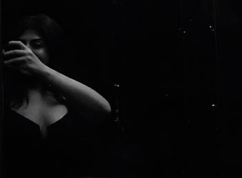 Portrait of woman in darkroom