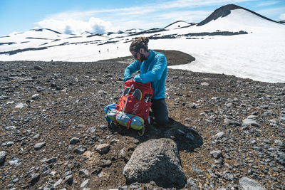 Layering up before traversing glacier