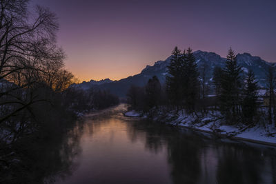 Scenic view of lake against sky during sunset