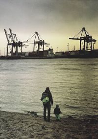 Silhouette of people in water