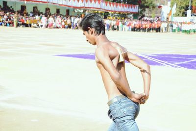 Full length of shirtless man
