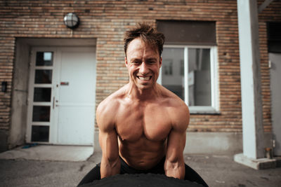 Mature man exercising in backyard