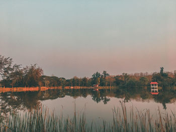 Scenic view of lake against sky at sunset