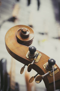 Close-up of double bass headstock in store