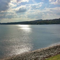 Scenic view of sea against cloudy sky