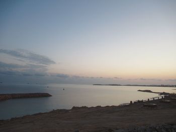 Scenic view of sea against sky at sunset