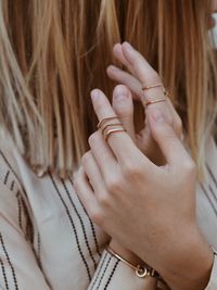 Close-up of midsection of woman wearing rings