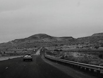 Country road leading towards mountains