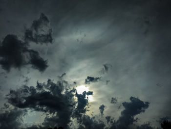 Low angle view of silhouette trees against sky at dusk