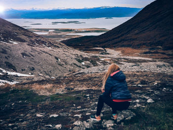 Rear view of woman looking at mountains