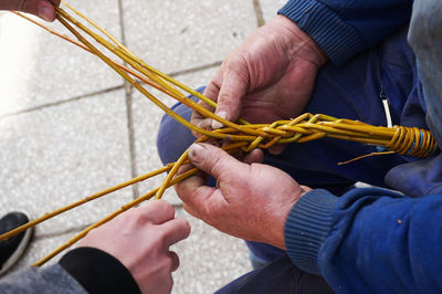 High angle view of people holding stem