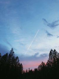 Low angle view of vapor trails in sky