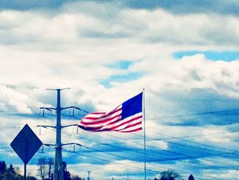 Low angle view of flags flag against sky