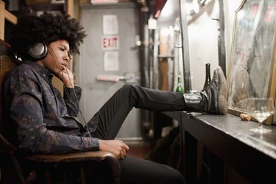 Young actor preparing backstage at a theater