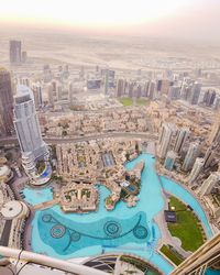 High angle view of swimming pool against buildings in city