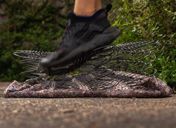 Low section of person wearing shoes outdoors