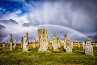 Callanish standing stones against rainbow