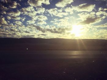 Scenic view of landscape against sky during sunset