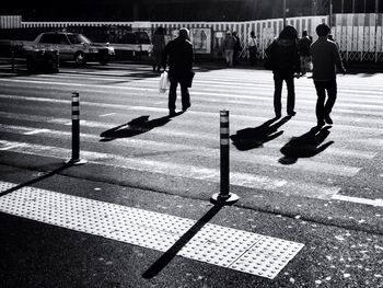 Woman walking on road