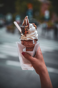 Hand holding ice cream