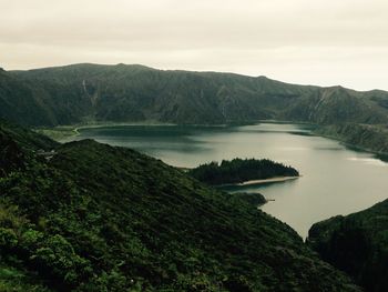 Scenic view of lake with mountains in background