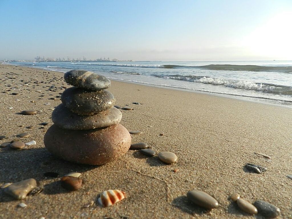 STACK OF PEBBLES ON BEACH