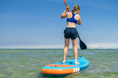 Full length of man standing on beach