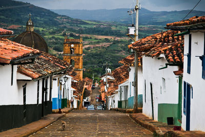 Narrow alley along red tiled buildings in colombia