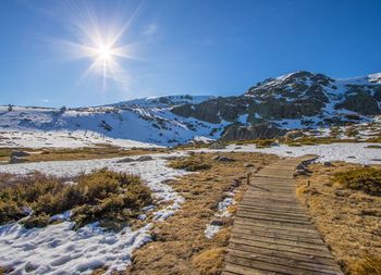 Scenic view of snowcapped mountains against sky