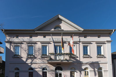 Low angle view of building against blue sky