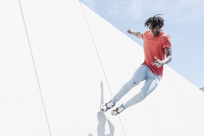 Energetic man jumping on ramp